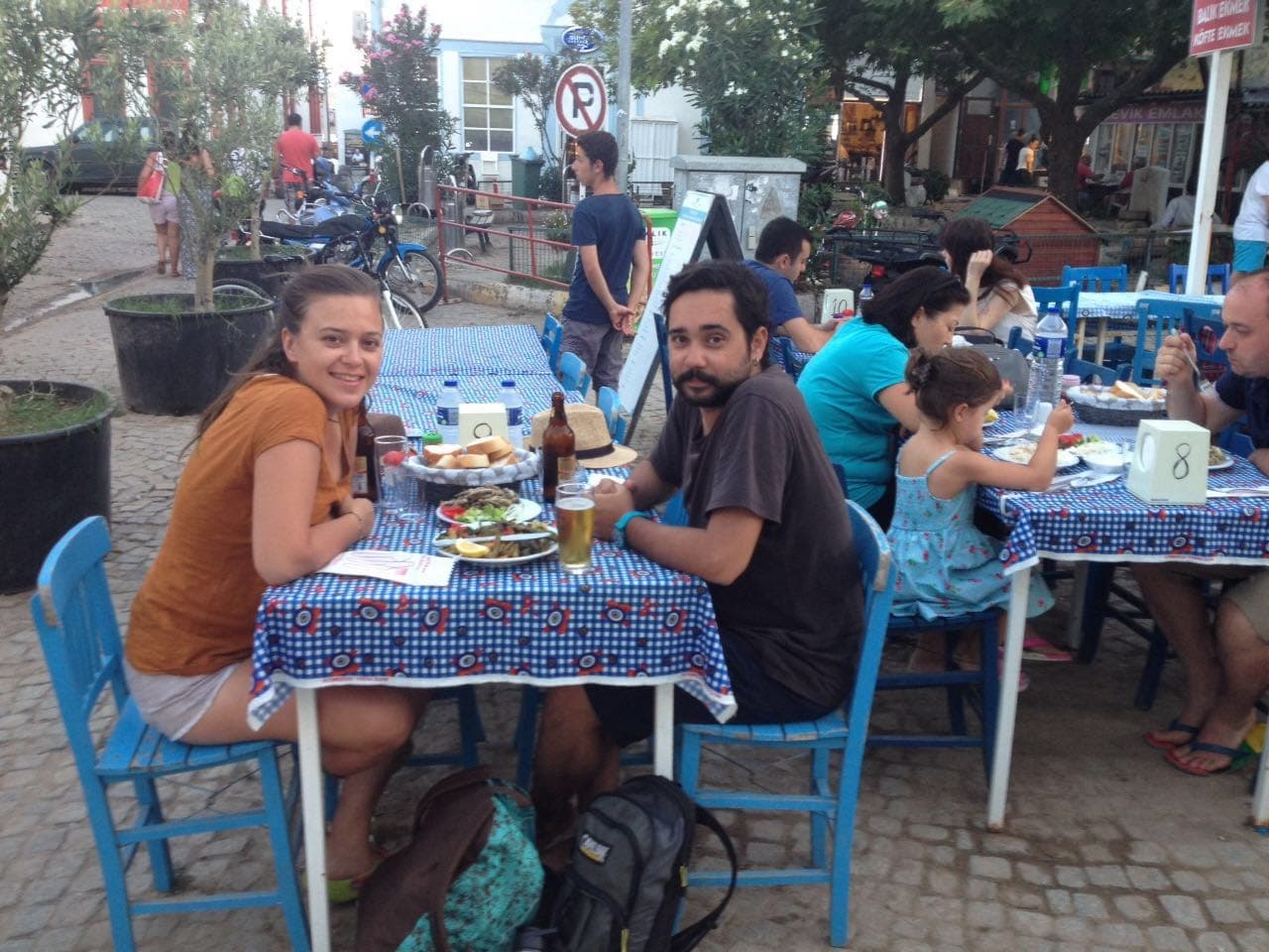 Alpgiray and Müge at a seaside table — Walktionary co-founders