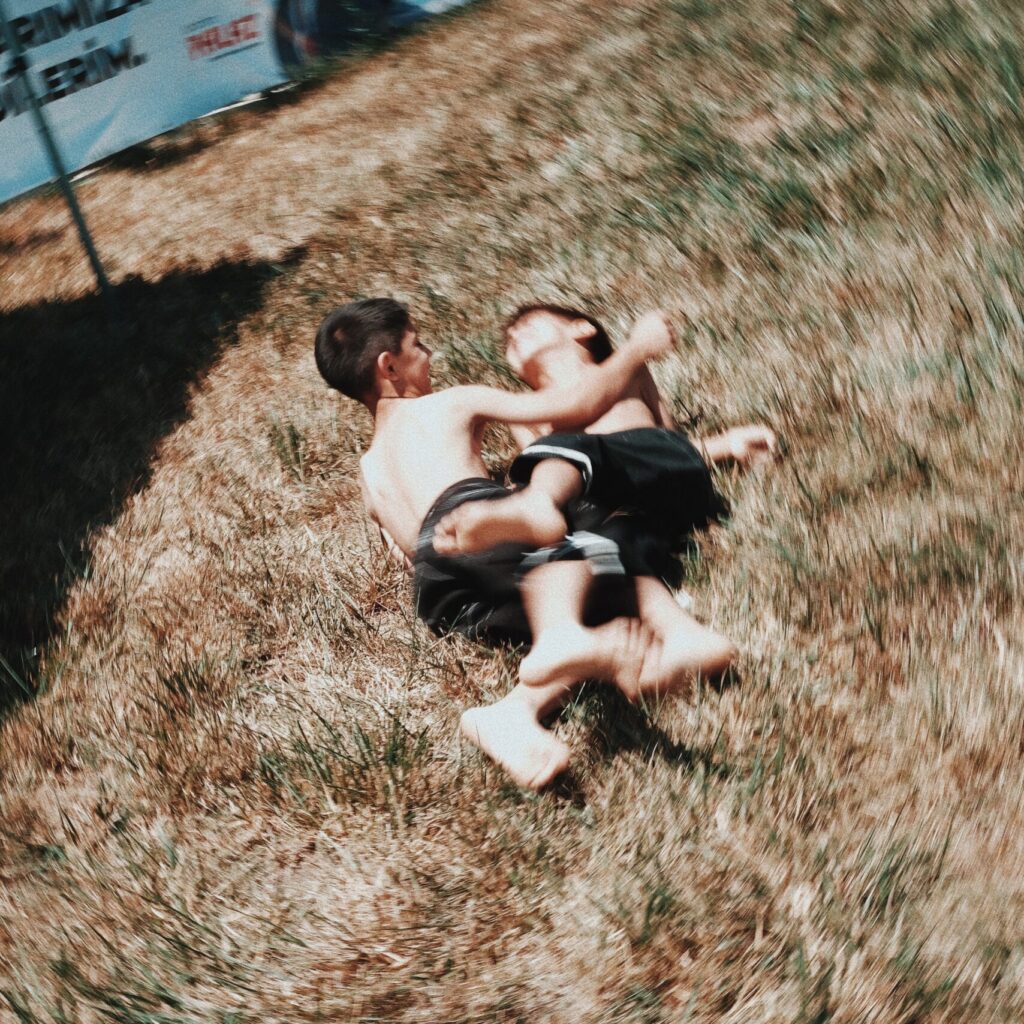 Two children are wrestling